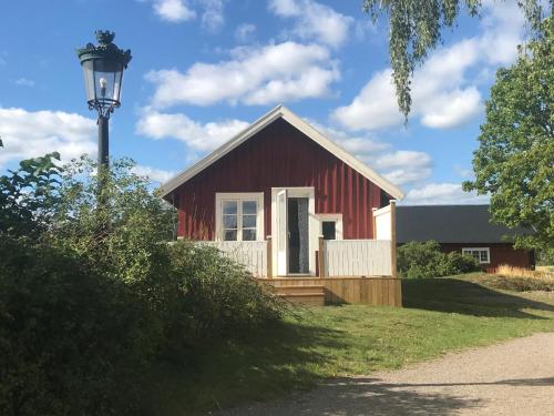 Nice holiday house at horse farm with lake and sauna